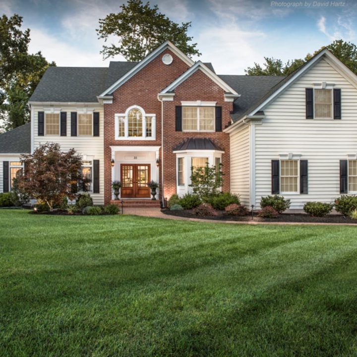 Lawn Care NJ Home with tree, shrub & lawn care service (grass is very green)