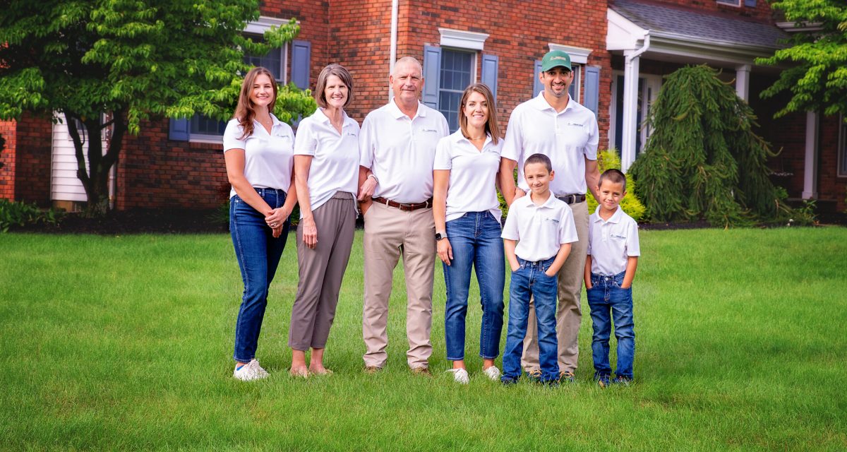 Family on green lawn